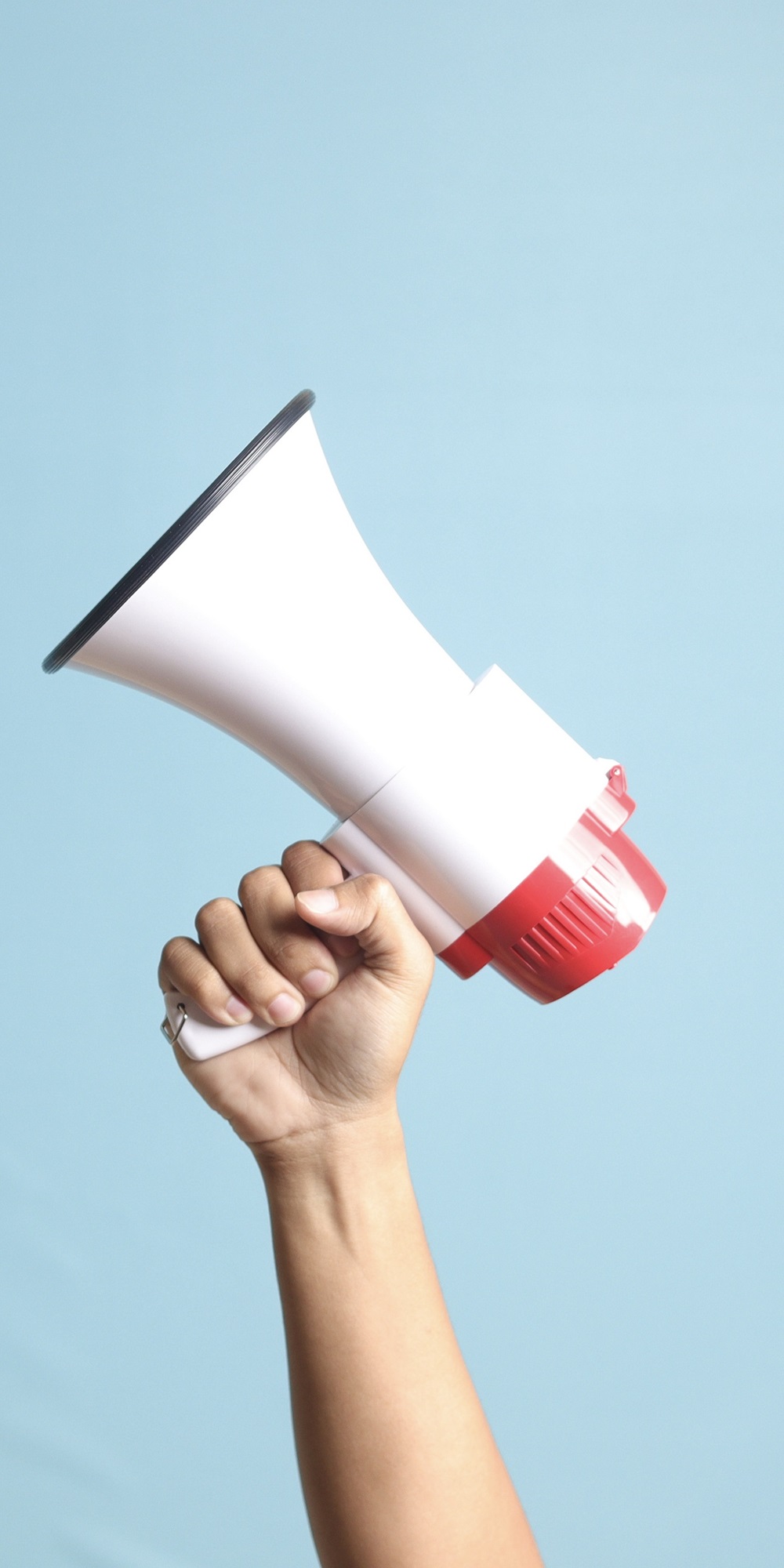 hand holding megaphone hand holding megaphone